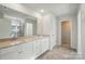 Bathroom with a double vanity, tile flooring and a view of the shower at 117 Rooster Tail Ln, Troutman, NC 28166