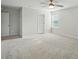 Large bedroom with neutral carpet, fan, and windows for great natural light at 117 Rooster Tail Ln, Troutman, NC 28166