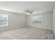 Spacious bedroom with a ceiling fan and two windows providing natural light at 117 Rooster Tail Ln, Troutman, NC 28166