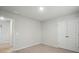 A bedroom featuring neutral walls, carpeted floors, and a double-door closet, creating a cozy space at 117 Rooster Tail Ln, Troutman, NC 28166