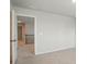 A bedroom shows neutral walls, a door, and carpeted floors, ready for your personal touch at 117 Rooster Tail Ln, Troutman, NC 28166