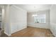Elegant dining room with wood floors, wainscoting, and a chandelier for a sophisticated touch at 117 Rooster Tail Ln, Troutman, NC 28166