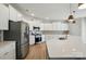 Kitchen with white cabinets and stainless steel appliances at 117 Rooster Tail Ln, Troutman, NC 28166