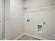 A laundry room featuring connections for a washer and dryer, and convenient overhead storage at 117 Rooster Tail Ln, Troutman, NC 28166