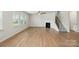 Living room showcasing an elegant fireplace and staircase at 117 Rooster Tail Ln, Troutman, NC 28166