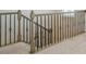 Staircase featuring decorative wrought iron spindles at 117 Rooster Tail Ln, Troutman, NC 28166