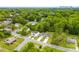 The aerial view shows a neighborhood with modern homes, green trees and glimpses of a city skyline at 1301 Marble St, Charlotte, NC 28208