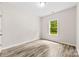 Bedroom featuring a window with a view of greenery at 1301 Marble St, Charlotte, NC 28208