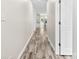 Inviting hallway boasting light-colored walls and beautiful, durable wood-look flooring at 1301 Marble St, Charlotte, NC 28208
