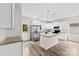 The modern kitchen features white cabinets, stainless steel appliances, and a granite-topped island at 1301 Marble St, Charlotte, NC 28208