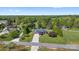 This aerial view shows a lovely house situated on a large lot with mature trees at 131 Fieldhaven Pl, Troutman, NC 28166