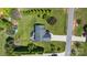 Breathtaking aerial view of the property showcasing lush greenery and driveway at 131 Fieldhaven Pl, Troutman, NC 28166