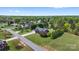 This aerial view showcases a charming house surrounded by mature trees in a suburban area at 131 Fieldhaven Pl, Troutman, NC 28166