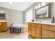 Bright bathroom with large soaking tub, double vanities, and tiled floors at 131 Fieldhaven Pl, Troutman, NC 28166