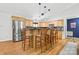 Spacious kitchen featuring stainless steel appliances, a breakfast bar, and hardwood floors at 131 Fieldhaven Pl, Troutman, NC 28166
