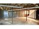 Unfinished basement with concrete floors, exposed ceiling, and block walls, offering potential for customization at 134 Piedmont Dr, Kannapolis, NC 28081