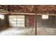 Unfinished basement with concrete floor, block walls, and garage door access offering a versatile space at 134 Piedmont Dr, Kannapolis, NC 28081