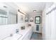 Functional bathroom with double sinks, a large mirror and classic tile at 134 Piedmont Dr, Kannapolis, NC 28081