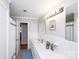 Functional bathroom with a single sink, a large mirror and classic tile at 134 Piedmont Dr, Kannapolis, NC 28081