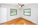 Bright bedroom with hardwood floors and two windows offering natural light at 134 Piedmont Dr, Kannapolis, NC 28081