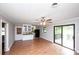 Open-concept living space with sliding door and ceiling fan at 134 Piedmont Dr, Kannapolis, NC 28081