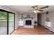 Cozy living room with a brick fireplace and built-in shelving at 134 Piedmont Dr, Kannapolis, NC 28081