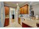Charming kitchen area with wood cabinets and view into the entryway at 138 Victoria Park Dr # 170, Shelby, NC 28150