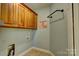 Convenient laundry room features storage cabinets and tile flooring at 138 Victoria Park Dr # 170, Shelby, NC 28150