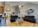 Open-concept living room showcasing vaulted ceilings and hardwood floors at 138 Victoria Park Dr # 170, Shelby, NC 28150