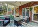 Covered patio with wicker furniture, a brick surround, and an outdoor table for relaxing or entertaining at 138 Victoria Park Dr # 170, Shelby, NC 28150