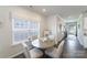 Cozy breakfast nook with a round table, four chairs, and natural light from a large window at 15520 Capps Rd, Charlotte, NC 28278