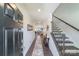 Inviting foyer with hardwood floors, staircase and hallway leading into the living area at 15520 Capps Rd, Charlotte, NC 28278