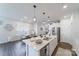Bright kitchen island with stainless steel dishwasher and a breakfast nook at 15520 Capps Rd, Charlotte, NC 28278