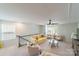 Bright living room with plush chairs, a ceiling fan, and a large window at 15520 Capps Rd, Charlotte, NC 28278