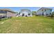 Spacious backyard with a patio, outdoor seating, grill, and a well-maintained lawn at 15520 Capps Rd, Charlotte, NC 28278