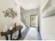 Bright foyer with decor and hardwood floors offers a welcoming entrance to the home at 15520 Capps Rd, Charlotte, NC 28278