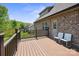 Large back deck with wood railing, patio furniture, and a view of the backyard at 1592 Farmington Hills Dr, Conover, NC 28613