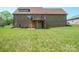 Brick home featuring a spacious green backyard and attached garage at 1592 Farmington Hills Dr, Conover, NC 28613