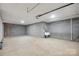 Spacious unfinished basement featuring concrete block walls and a utility sink at 1592 Farmington Hills Dr, Conover, NC 28613
