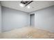 Spacious unfinished basement featuring a dropped ceiling and recessed lights at 1592 Farmington Hills Dr, Conover, NC 28613