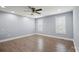 Bright and airy bedroom with hardwood floors, recessed lighting, ceiling fan, and two windows at 1592 Farmington Hills Dr, Conover, NC 28613