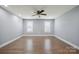 Bright bedroom featuring hardwood floors, neutral walls, recessed lights, and ceiling fan at 1592 Farmington Hills Dr, Conover, NC 28613