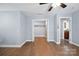 A light and airy bedroom with hardwood floors and a view to the bathroom at 1592 Farmington Hills Dr, Conover, NC 28613