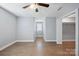 This bedroom features hardwood floors, a ceiling fan, and a closet with folding doors at 1592 Farmington Hills Dr, Conover, NC 28613