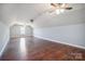 Huge bonus room with hardwood floors, neutral walls, ceiling fan, and lots of space at 1592 Farmington Hills Dr, Conover, NC 28613
