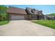 Stunning brick home featuring an attached two-car garage and a spacious concrete driveway at 1592 Farmington Hills Dr, Conover, NC 28613