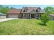 Beautiful single-Gathering home featuring a well-manicured front lawn and a two-car attached garage at 1592 Farmington Hills Dr, Conover, NC 28613