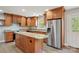 Gourmet kitchen with granite countertops, center island, and stainless steel appliances at 1592 Farmington Hills Dr, Conover, NC 28613