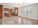 Open concept kitchen and dining area with hardwood floors and natural light at 1592 Farmington Hills Dr, Conover, NC 28613