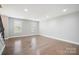Bright living area boasting hardwood floors and a staircase at 1592 Farmington Hills Dr, Conover, NC 28613